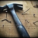 Black Claw Hammer on Brown Wooden Plank