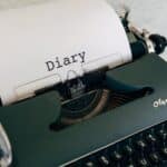 An Old Typewriter on White Table