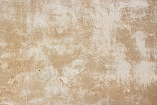 Beige and white worn down wall