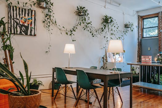 Interior of cozy modern dining room with chairs and table