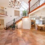 Interior of house with open kitchen near staircase