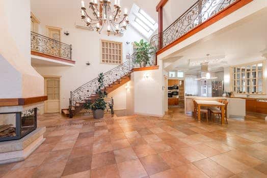 Interior of house with open kitchen near staircase