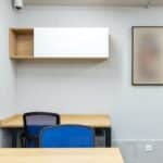 Interior of office with tables and chairs