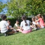 Kids Doing Activity on Green Grass Field