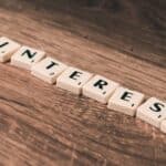 Scrabble Tiles Forming Pinterest Word on Brown Wooden Surface