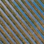 Textured background of solar panels in countryside field