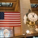 Vintage clock against American flag