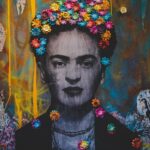 Creative artwork with Frida Kahlo painting decorated with colorful floral headband on graffiti wall