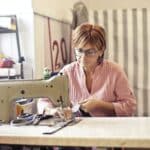 Photo of Woman Using Sewing Machine