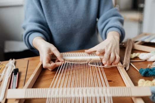 Person Weaving Using Hand Loom