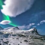 Scenic View Of Snow Capped Mountains During Night