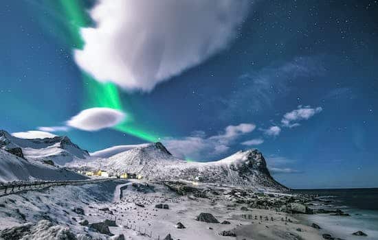 Scenic View Of Snow Capped Mountains During Night