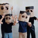 A Family Wearing a Diy Cardboard Box Mask