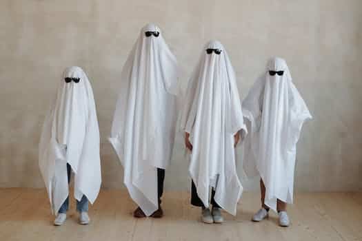 A Family Wearing White Halloween Costume