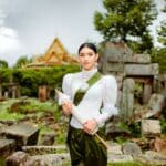 A woman in traditional clothing holding a sword