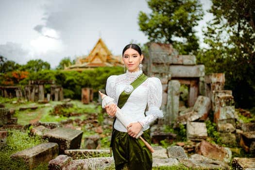 A woman in traditional clothing holding a sword