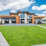 Exterior of modern house with glass doors and panoramic windows