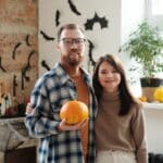 Man Holding A Pumpkin