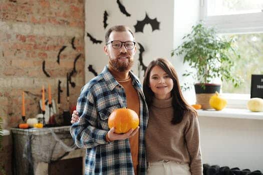 Man Holding A Pumpkin