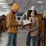 Man in Yellow Knit Cap and Brown and White Plaid Dress Shirt