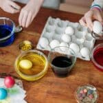 White Eggs Dip on Colorful Liquid